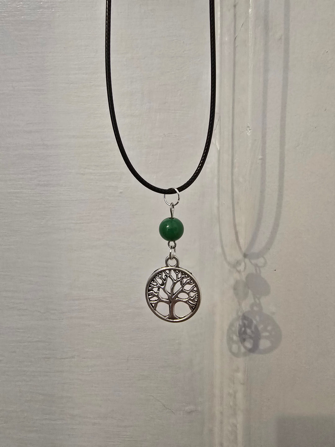 Emerald Tree of Life Talisman — handcrafted gemstone pendant on black cord