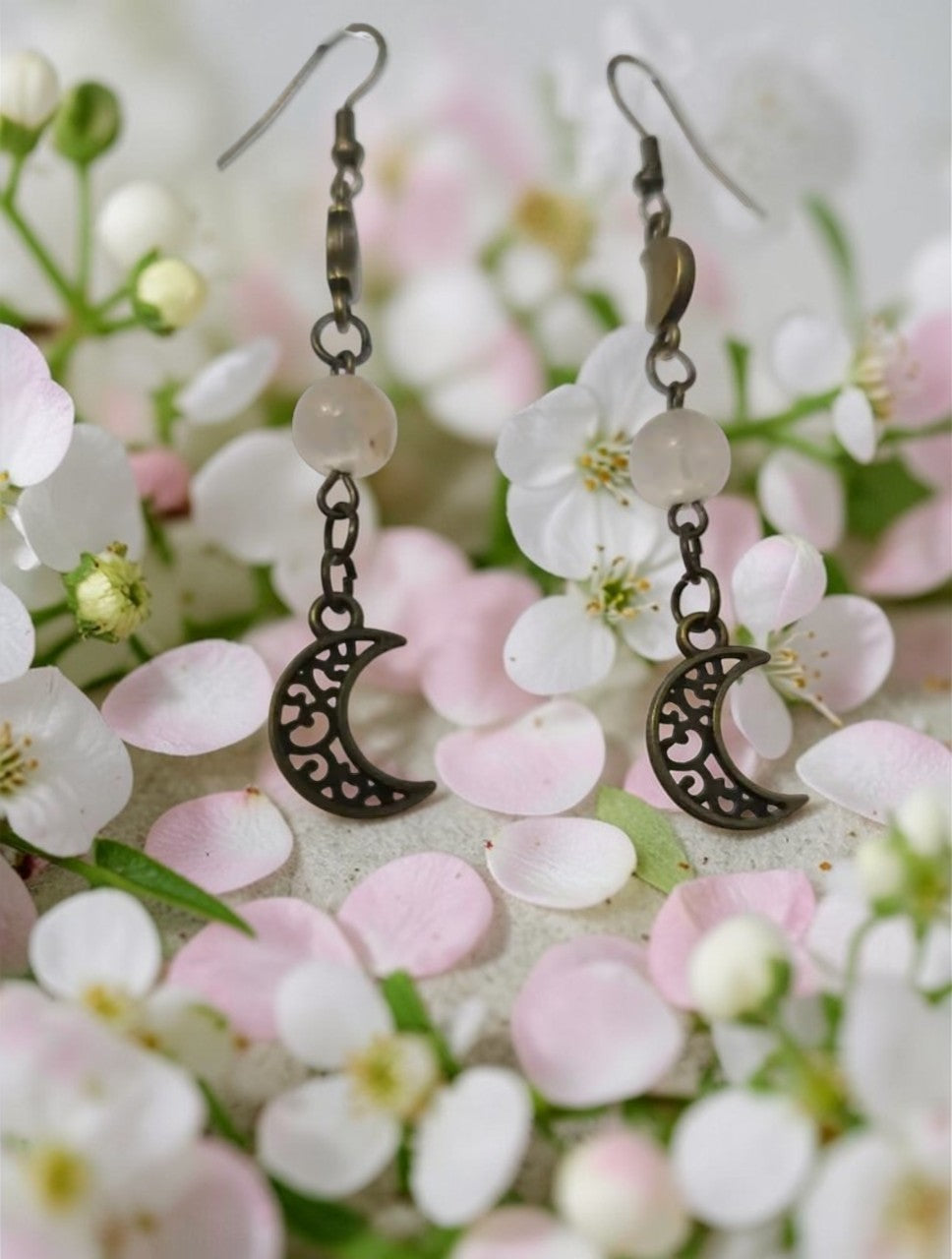 Image 6: Moonstone moon earrings detail – intricate filigree bronze crescent design